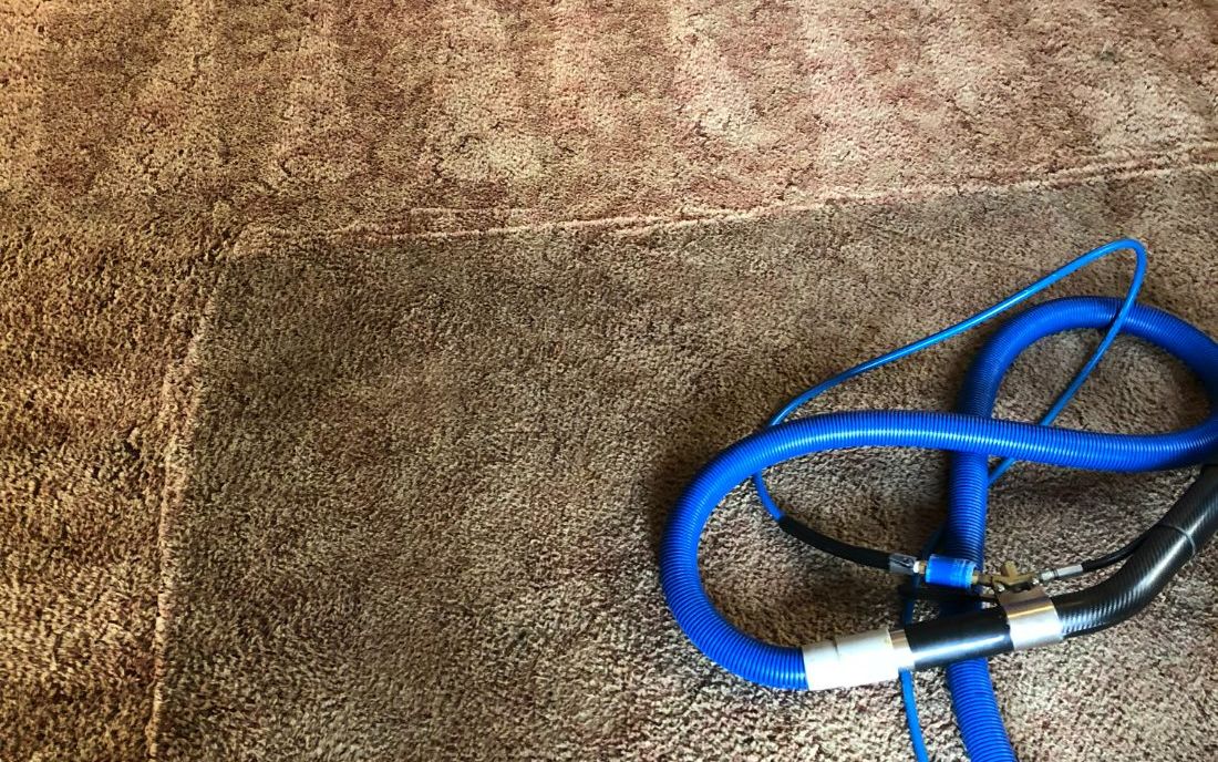 Before and after: cleaned carpet next to an uncleaned section